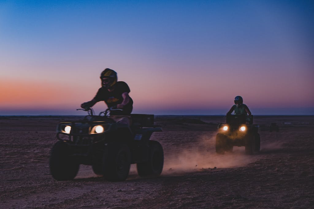 Exciting ATV ride at sunset in the expansive Namib Desert near Gobabeb, Namibia.