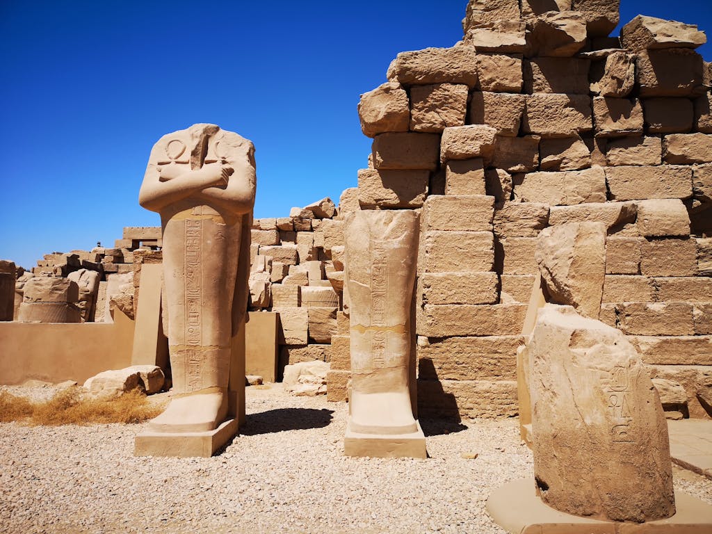 Explore the historic Karnak Temple in Luxor, showcasing ancient Egyptian ruins bathed in sunlight.