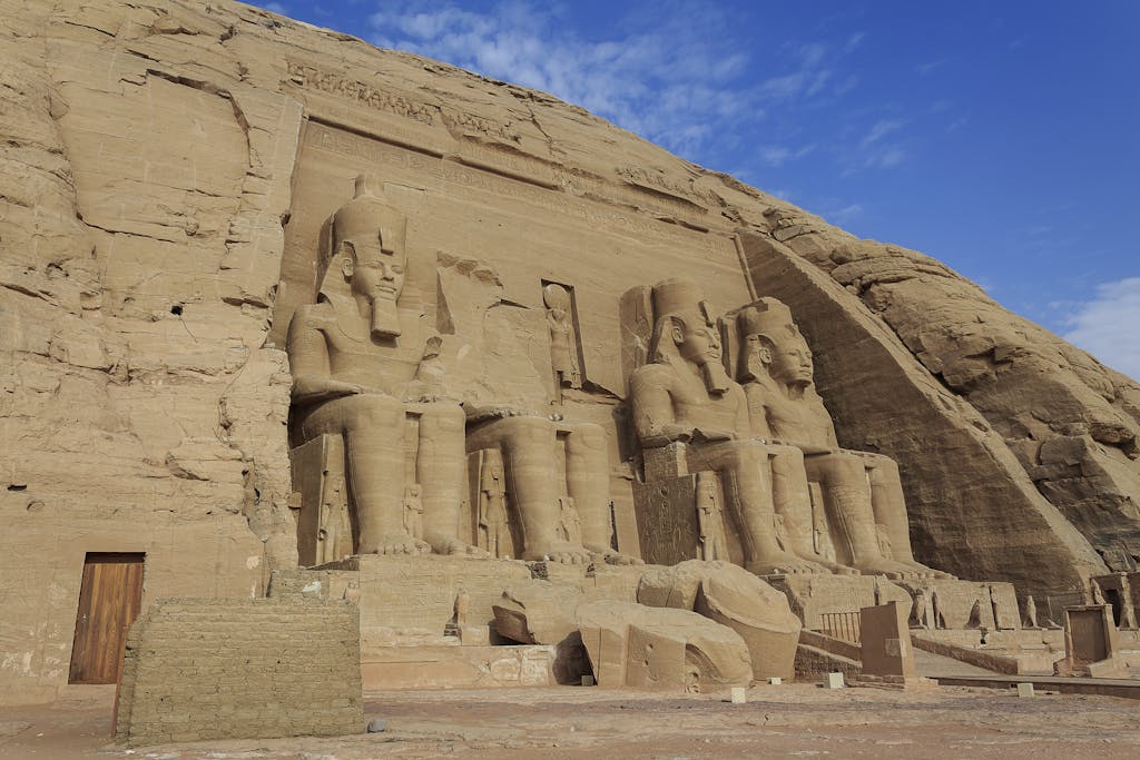 Majestic view of the Abu Simbel Temples carved into rock in Egypt, showcasing ancient Egyptian architecture.