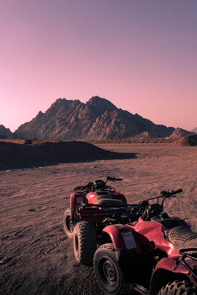 Quad bikes on a desert landscape in Sharm El-Sheikh, Egypt at sunset.